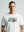 Man wearing a white ultras 1312 acab t-shirt with a graphic design on a plain background