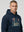 Man wearing a ultras away days navy hoodie with a graphic design on a light gray background