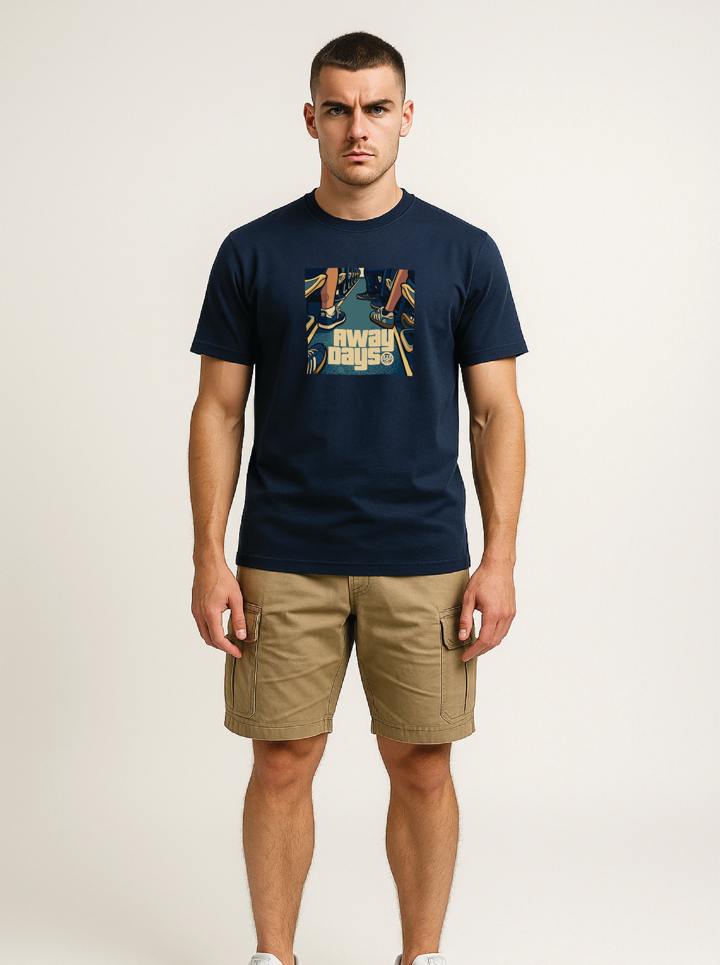 ultras Man wearing a navy t-shirt with a AWAY DAYS graphic design and beige shorts on a white background