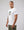 Casuals ultras Man wearing a white england World Cup  t-shirt with a graphic design on a plain background
