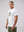 Casuals ultras Man wearing a white england World Cup  t-shirt with a graphic design on a plain background