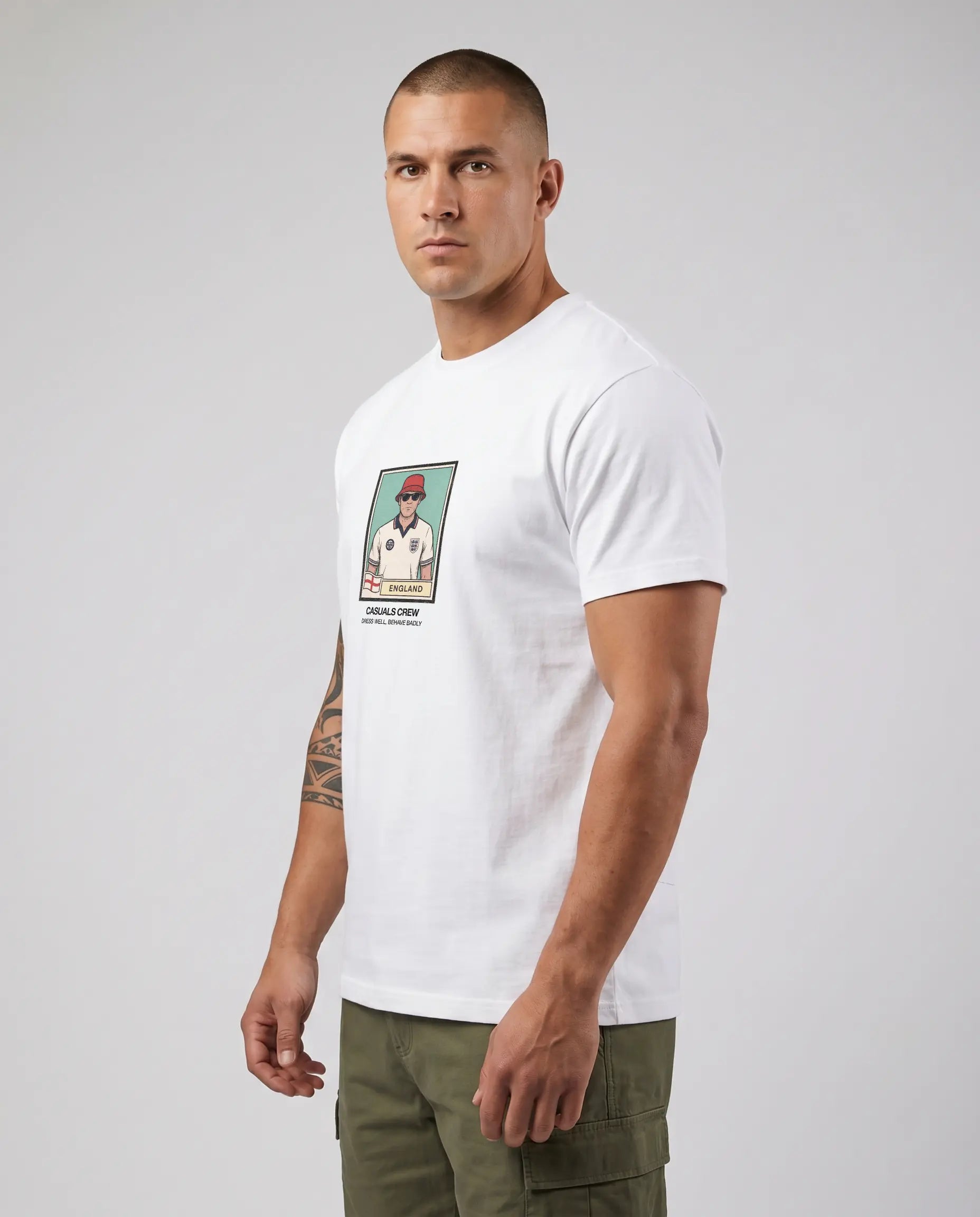 Casuals ultras Man wearing a white england World Cup  t-shirt with a graphic design on a plain background