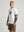 casuals ultras Man wearing a white France World Cup  t-shirt with a graphic design on a gray background