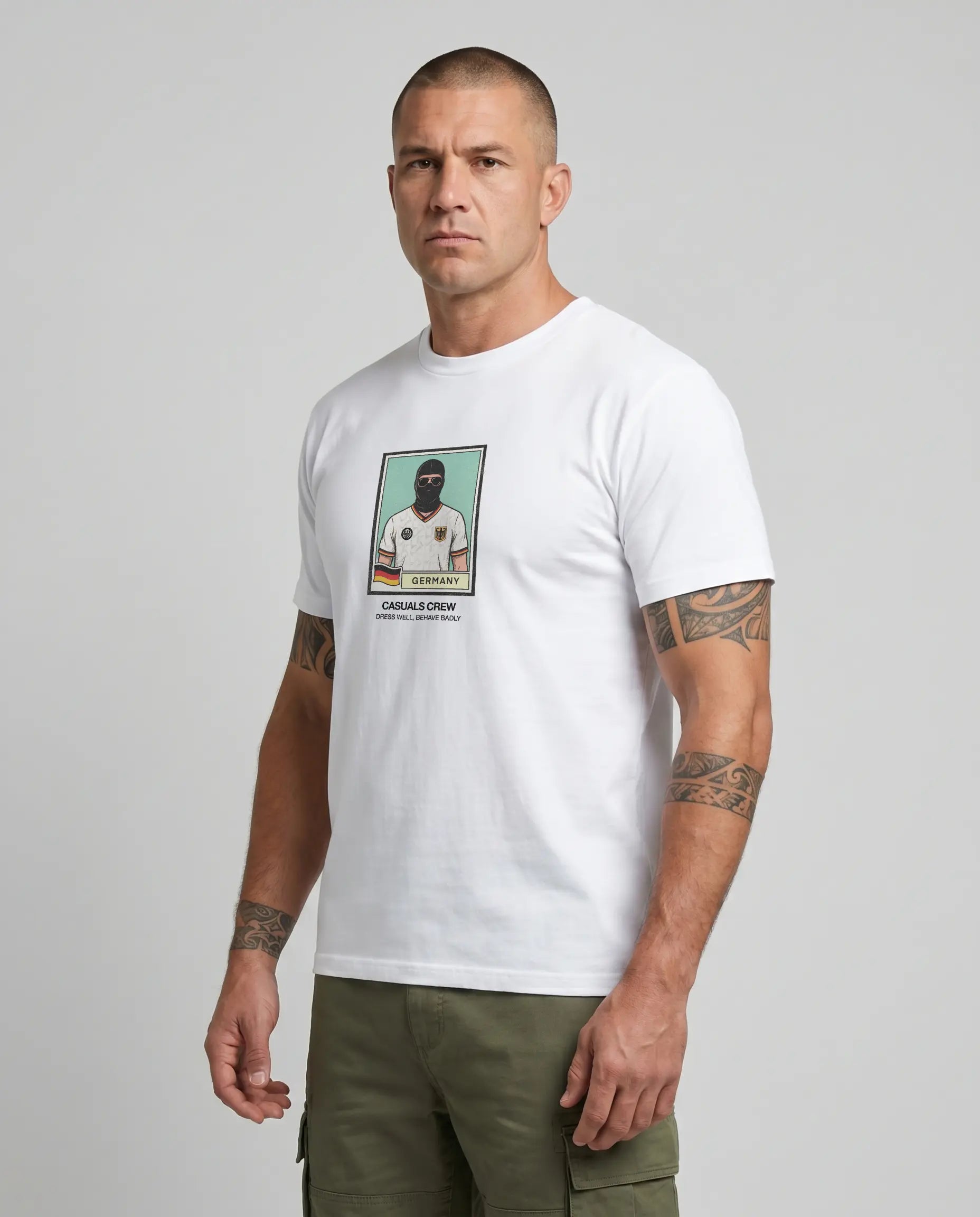 casuals ultras Man wearing a white Germany World Cup  t-shirt with a graphic design on a gray background