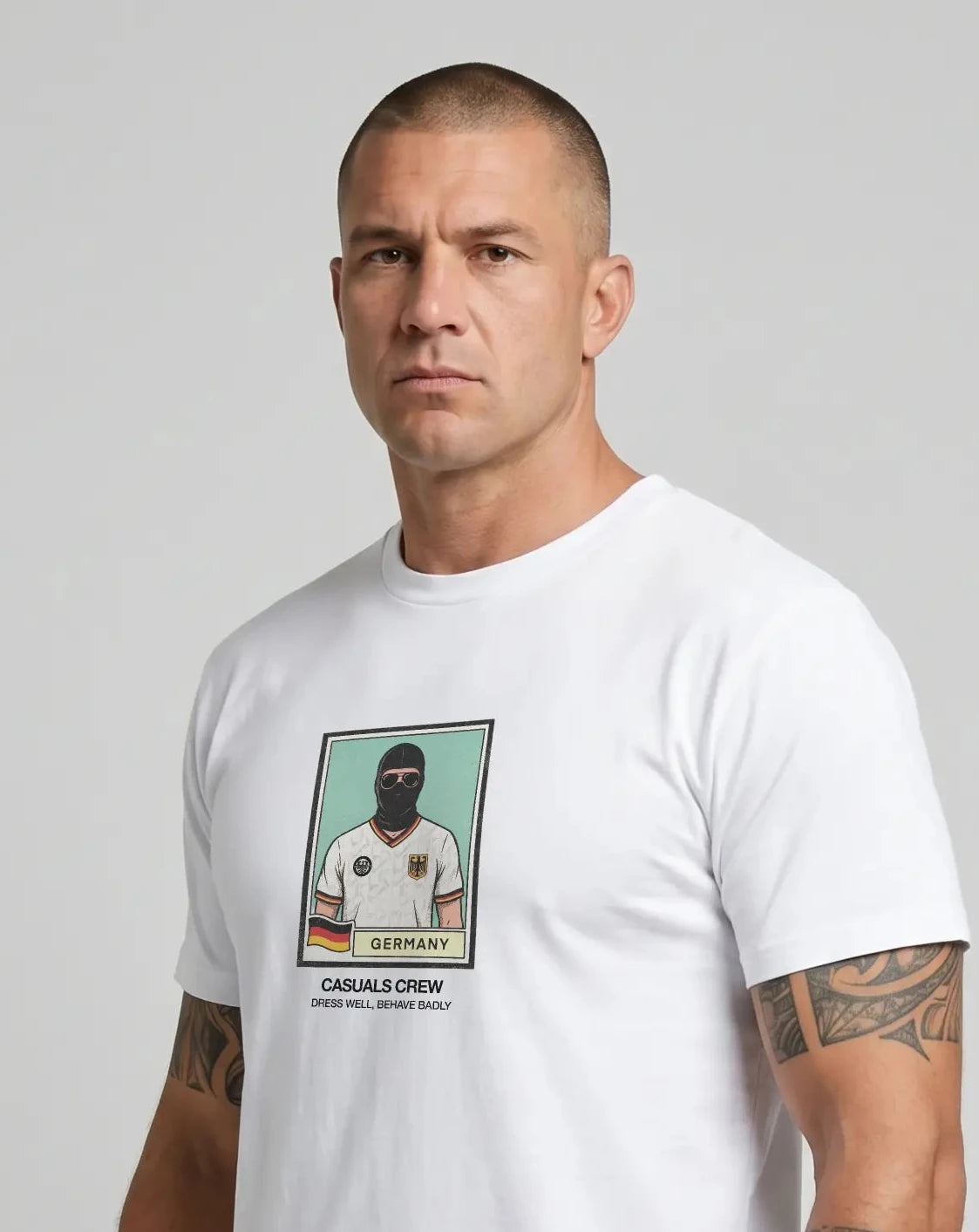 casuals ultras Man wearing a white Germany World Cup  t-shirt with a graphic design on a gray background