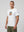 casuals ultras Man wearing a white Holland World Cup  t-shirt with a graphic design on a gray background