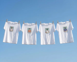 Four white casuals ultras World Cup  t-shirts with printed images on a clothesline against a blue sky.